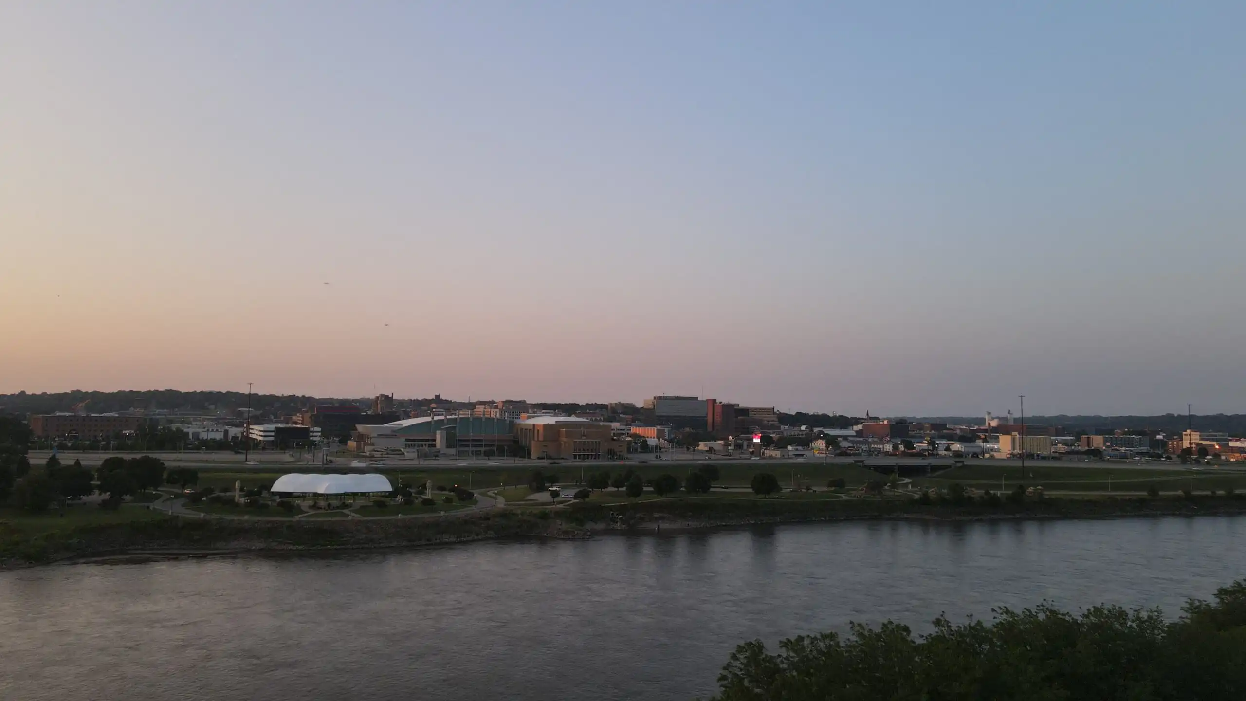 Panoramic view of downtown Sioux City, Iowa, at dusk, with the Missouri River and city skyline